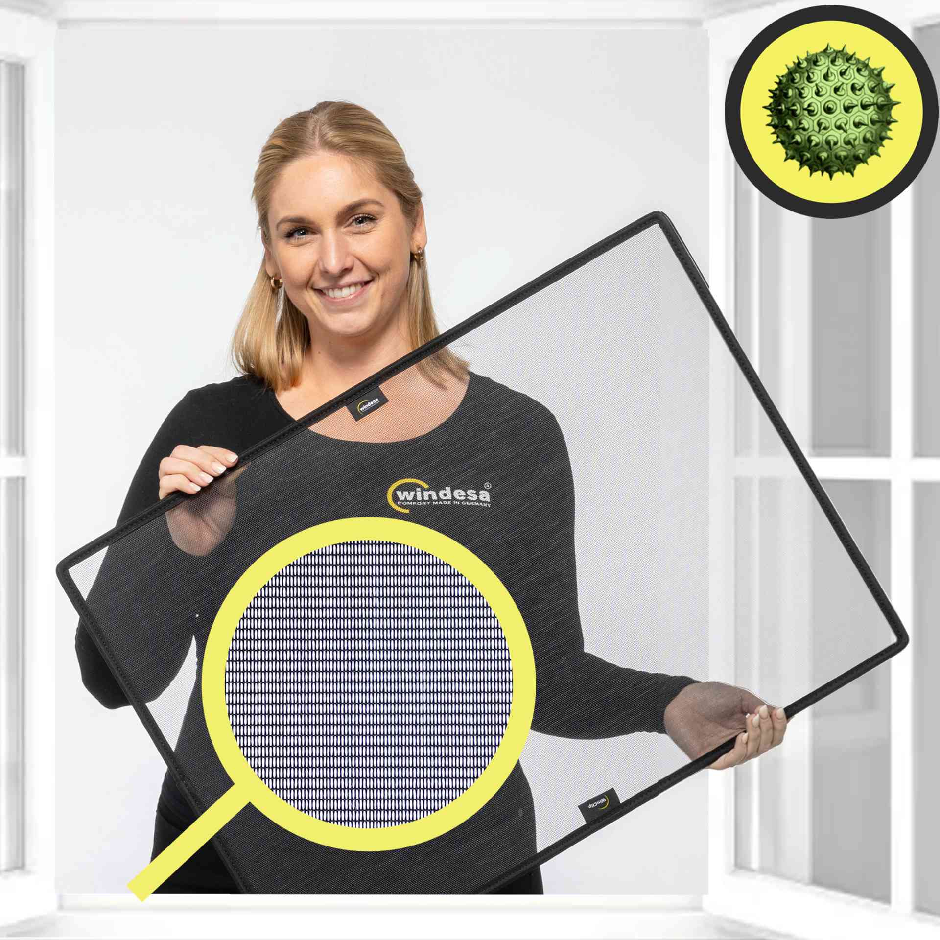 a woman smilingly holds the winclip pollen in the air