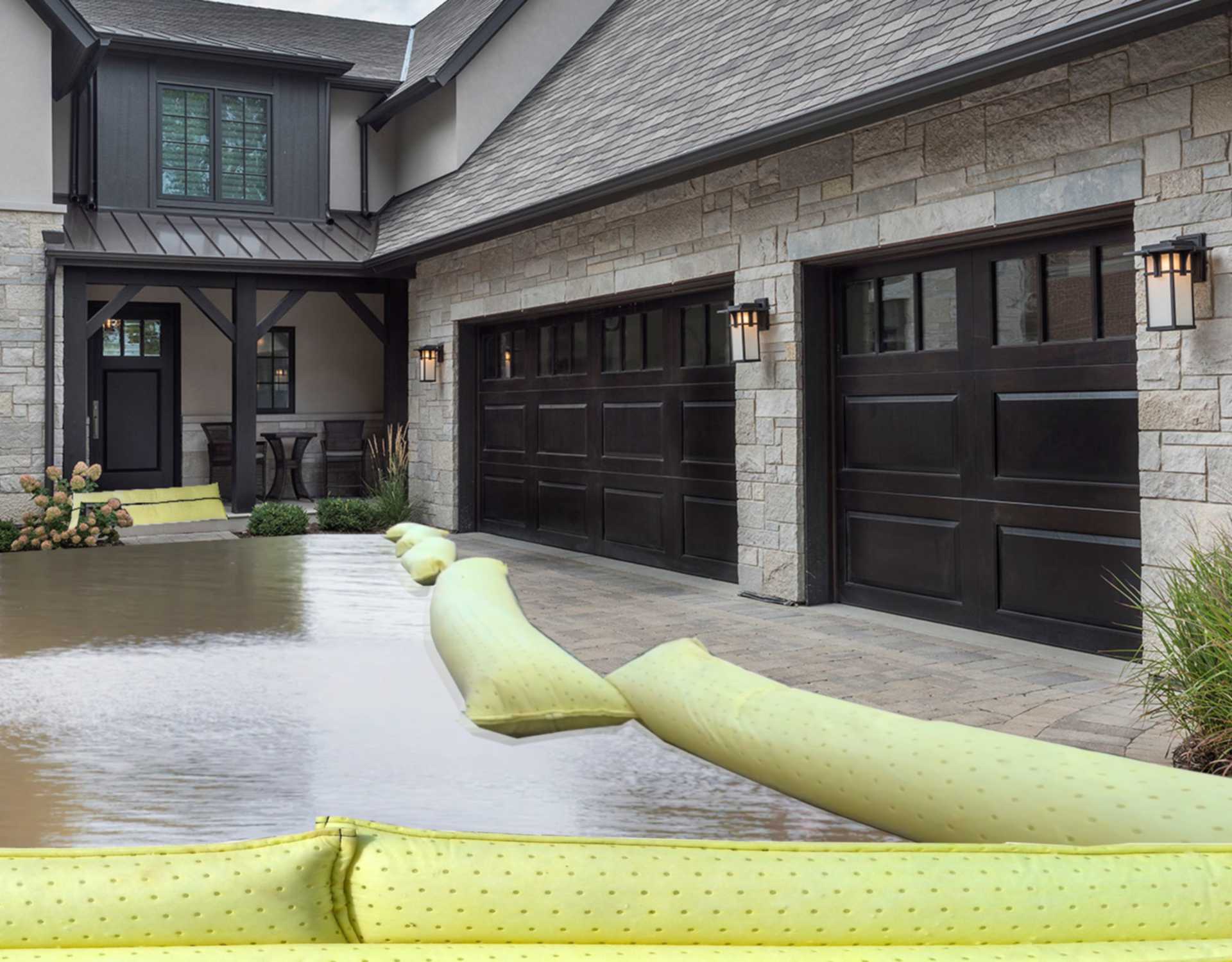 There are water protection hoses in front of a house to protect against the ingress of floodwater