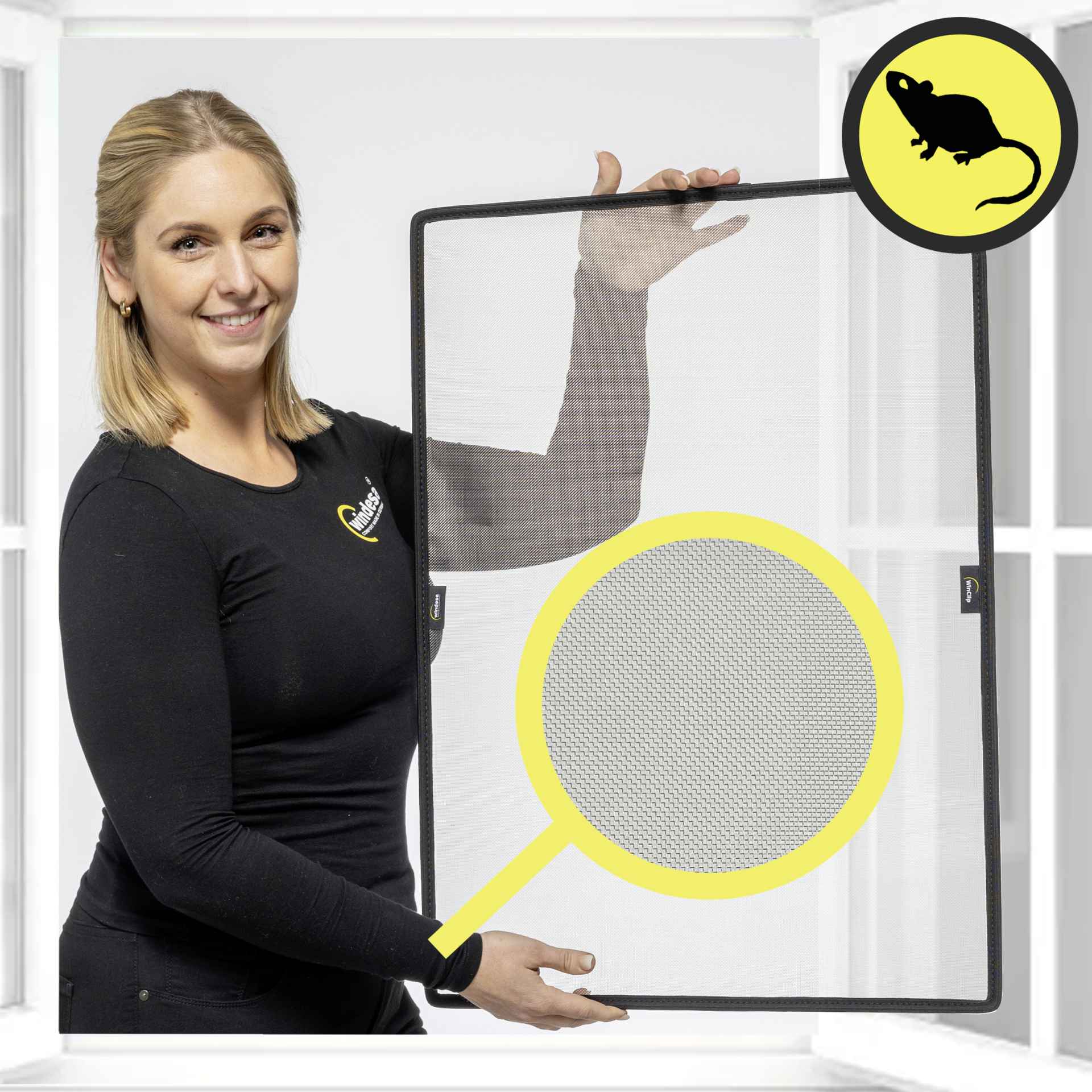 a smiling woman holds the WinClip Safe in her hands